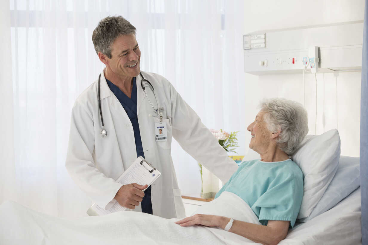 Care worker supporting elderly people